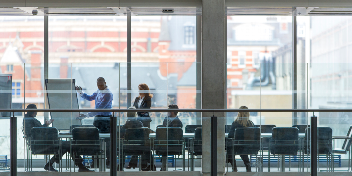 Board meeting in a glass meeting room